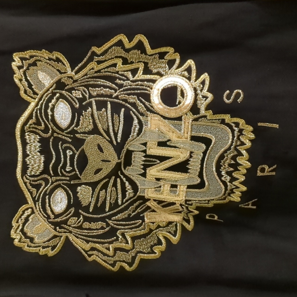 Kenzie sweater with gold tiger, size small. Bnwt.  Size small but like us xs